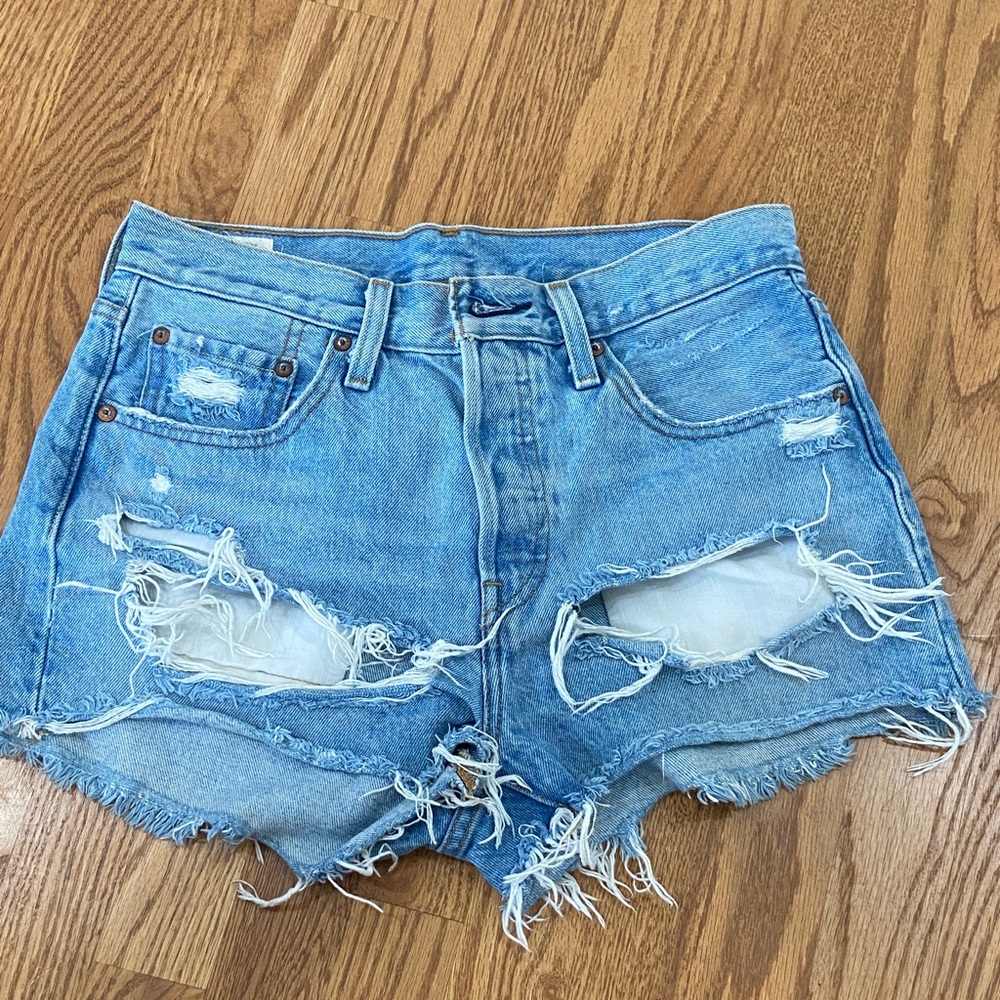 Levi's 501 distressed jean shorts in Light Blue Denim